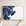 Tybee Island canvas map — hands holding the canvas in an oak frame