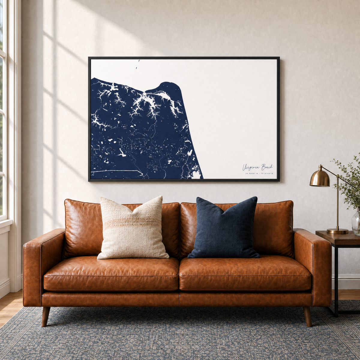 Virginia Beach canvas map — two-pillow black-frame sofa interior