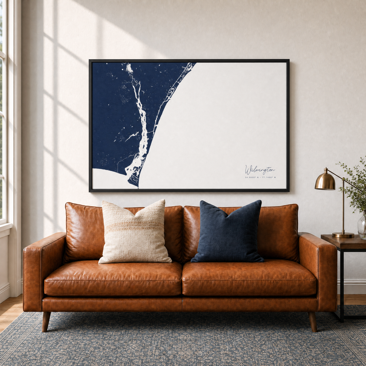 Wilmington canvas map — two-pillow black-frame sofa interior