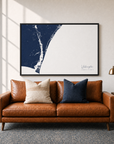Wilmington canvas map — two-pillow black-frame sofa interior