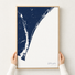 Wilmington canvas map — hands holding the canvas in an oak frame